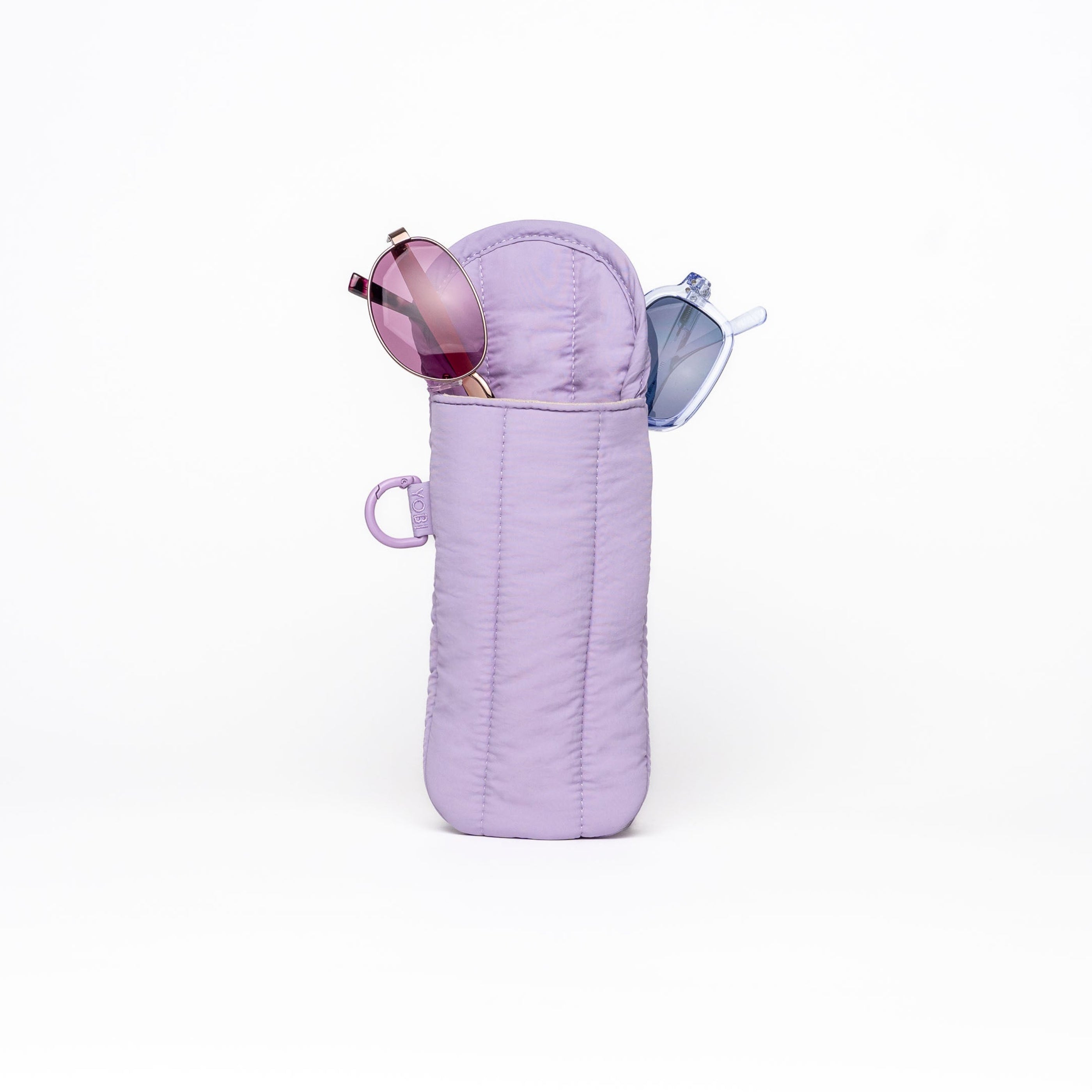 A lavender purple quilted sunglasses case standing upright on a white background, with a pair of sunglasses resting inside and a small blue accessory peeking out from the side.