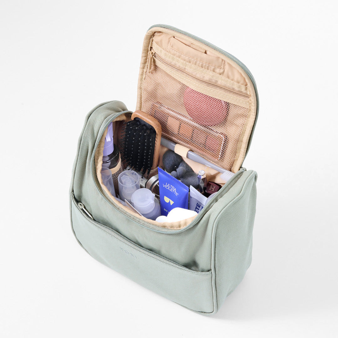 Travel Toiletry Bag filled with makeup and skincare