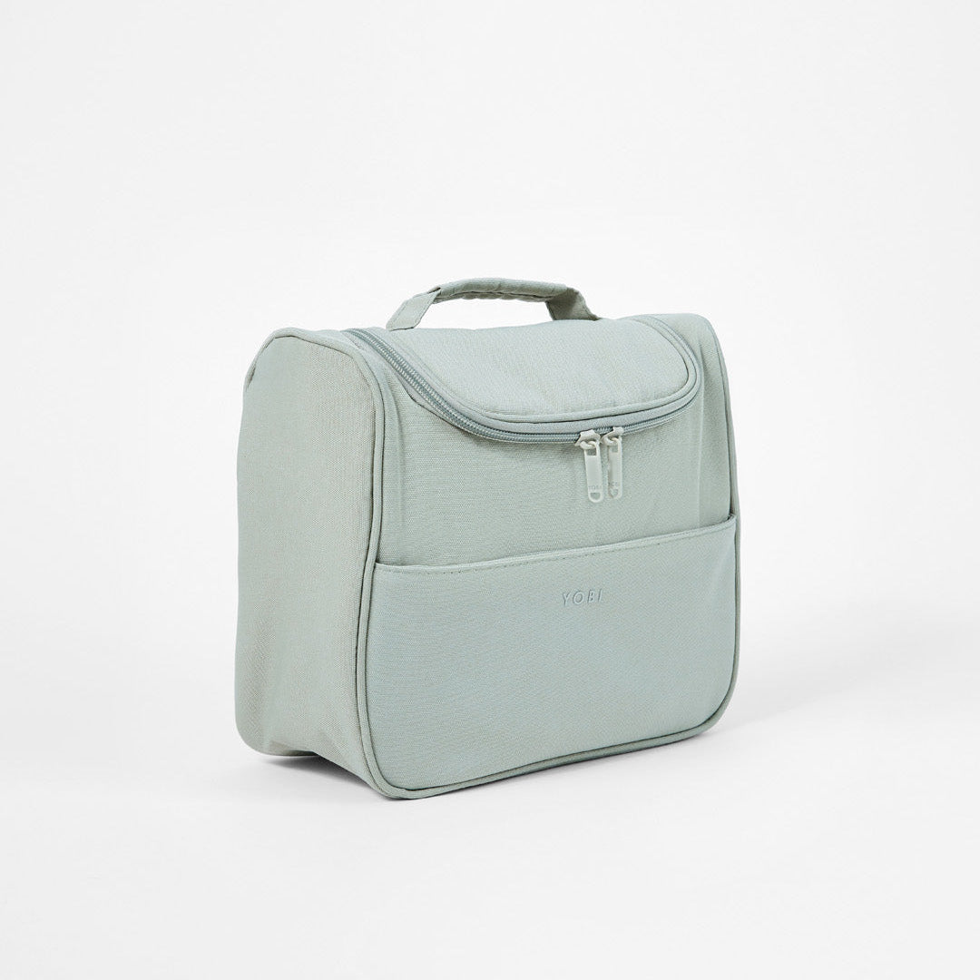 Spacious travel toiletry bag with a front zipped pocket for easy access
